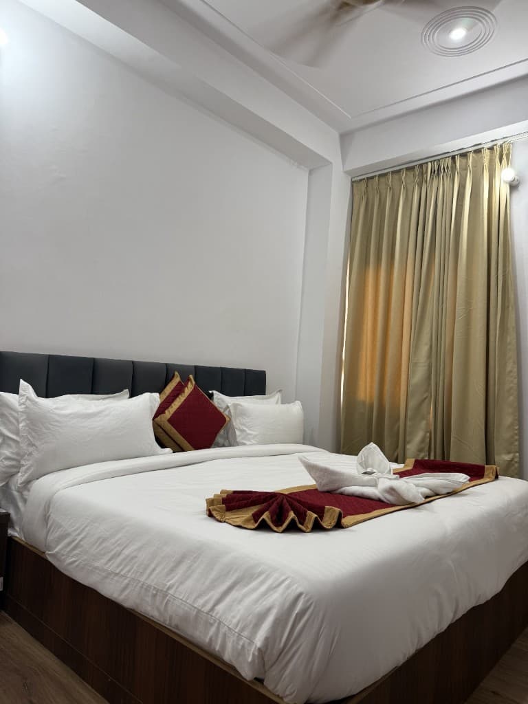 Comfortable hotel room with elegant bed setup